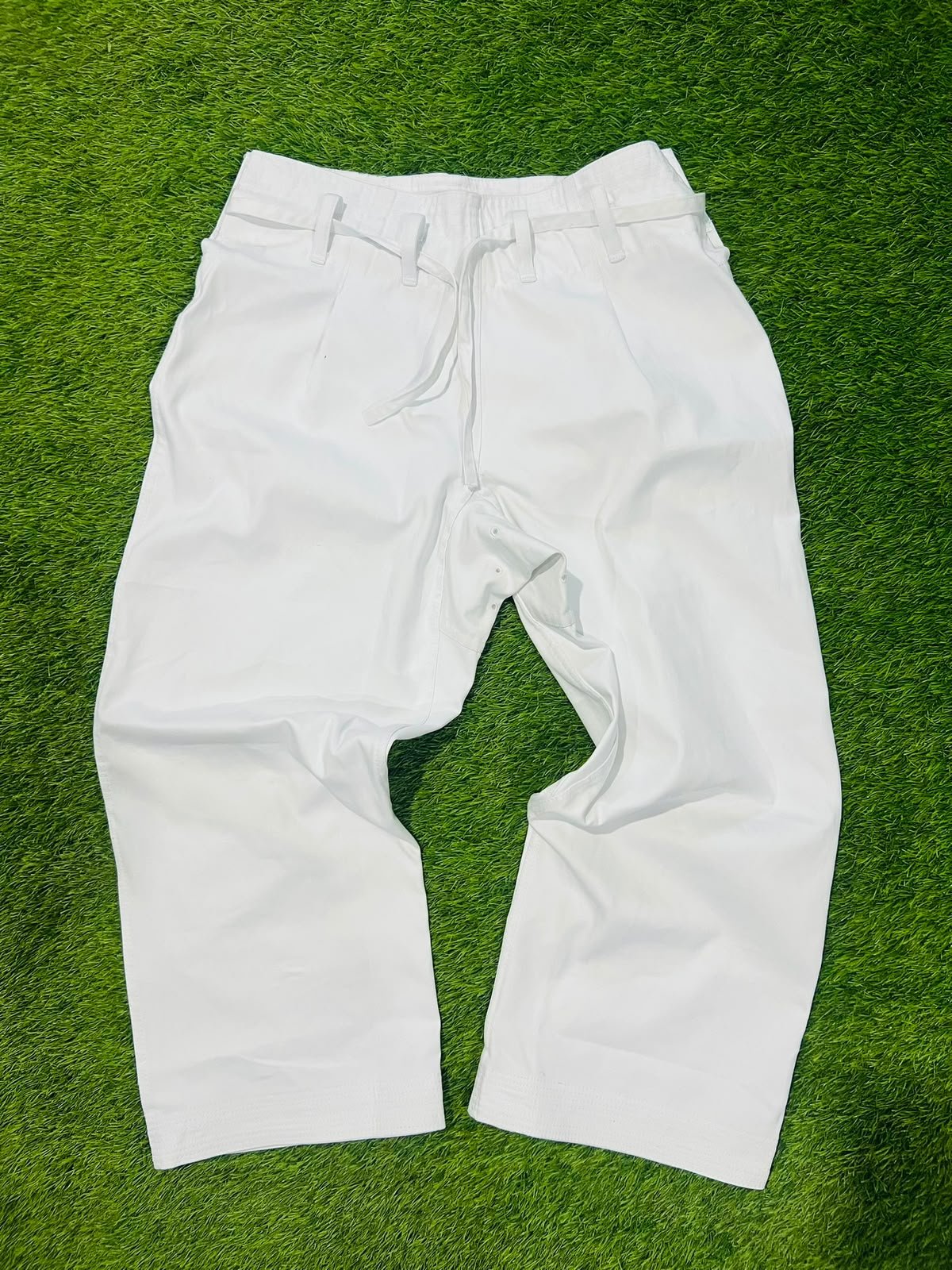 White karate gi trousers with a traditional drawstring waist